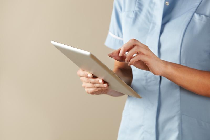an lady holding an ipad